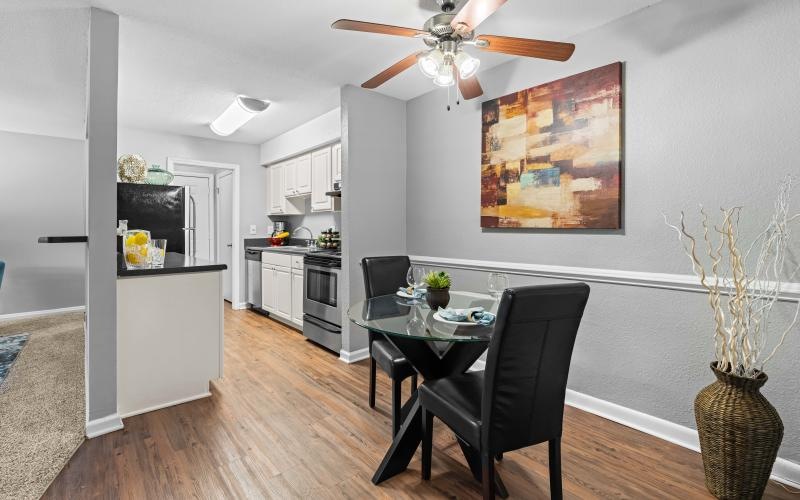 a kitchen with a table and chairs