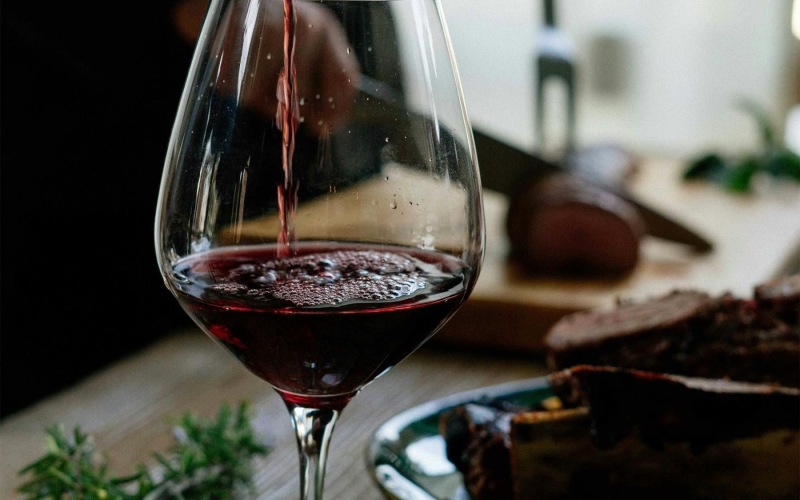a glass of wine on a table