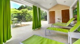Spacious cabana area with sectional curtains and adjustable lounge chairs